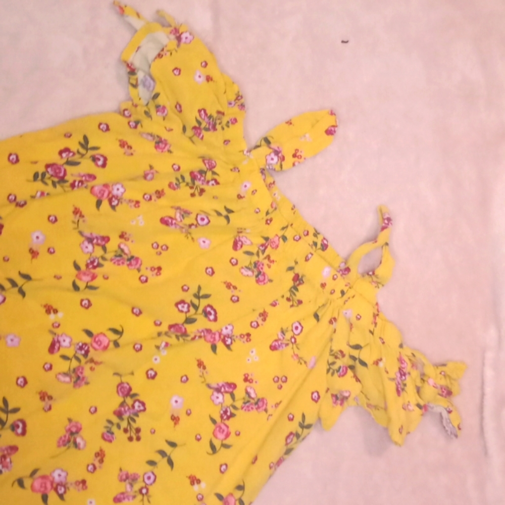 I am selling a nice of the shoulder yellow top with a pretty flower pattern